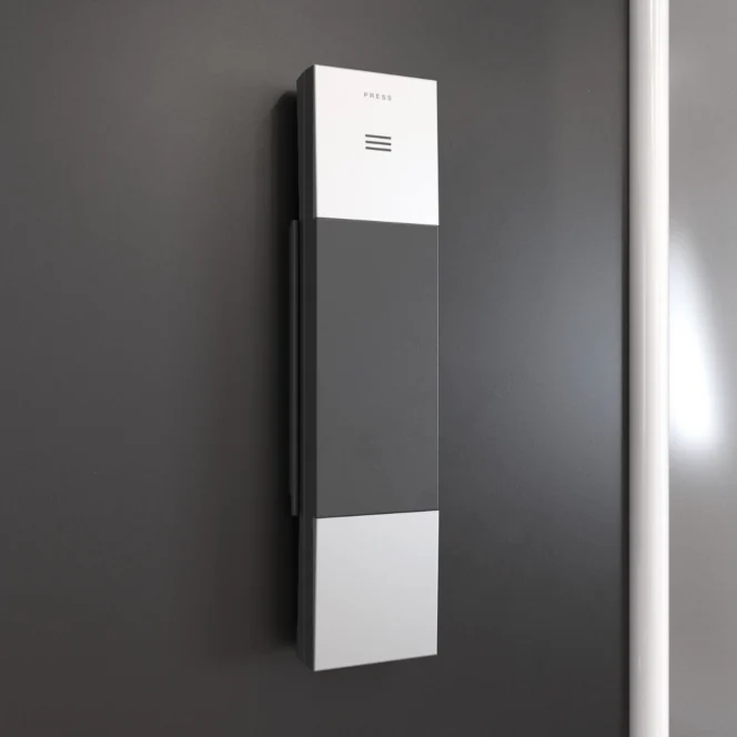 Een moderne, rechthoekige intercom voor wandmontage met een minimalistisch ontwerp, voorzien van een luidsprekerrooster en een knop met het opschrift „PRESS“ op een donkergrijze muur.